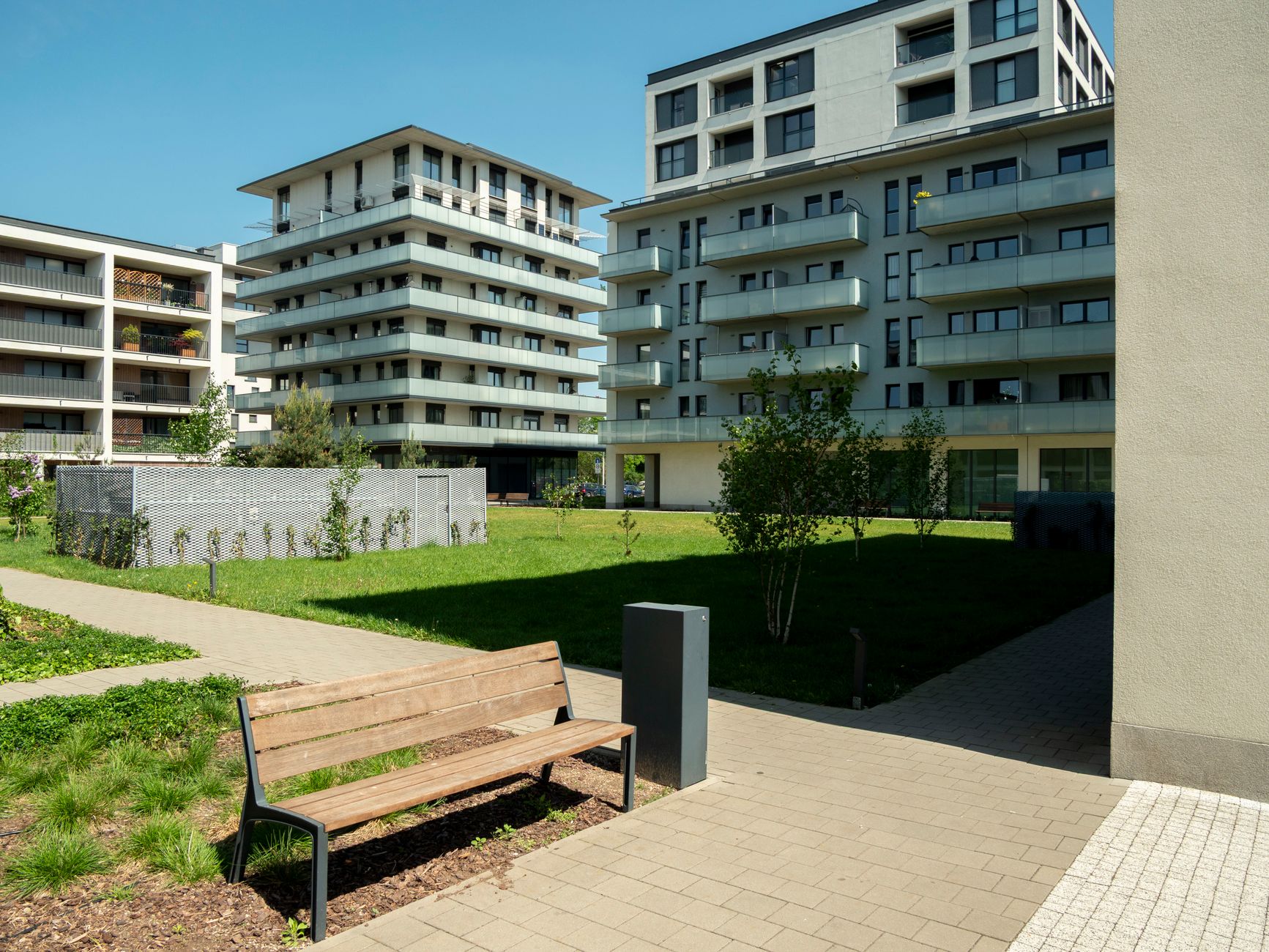 Contemporary apartment buildings with green spaces in Wrocław, Poland.
