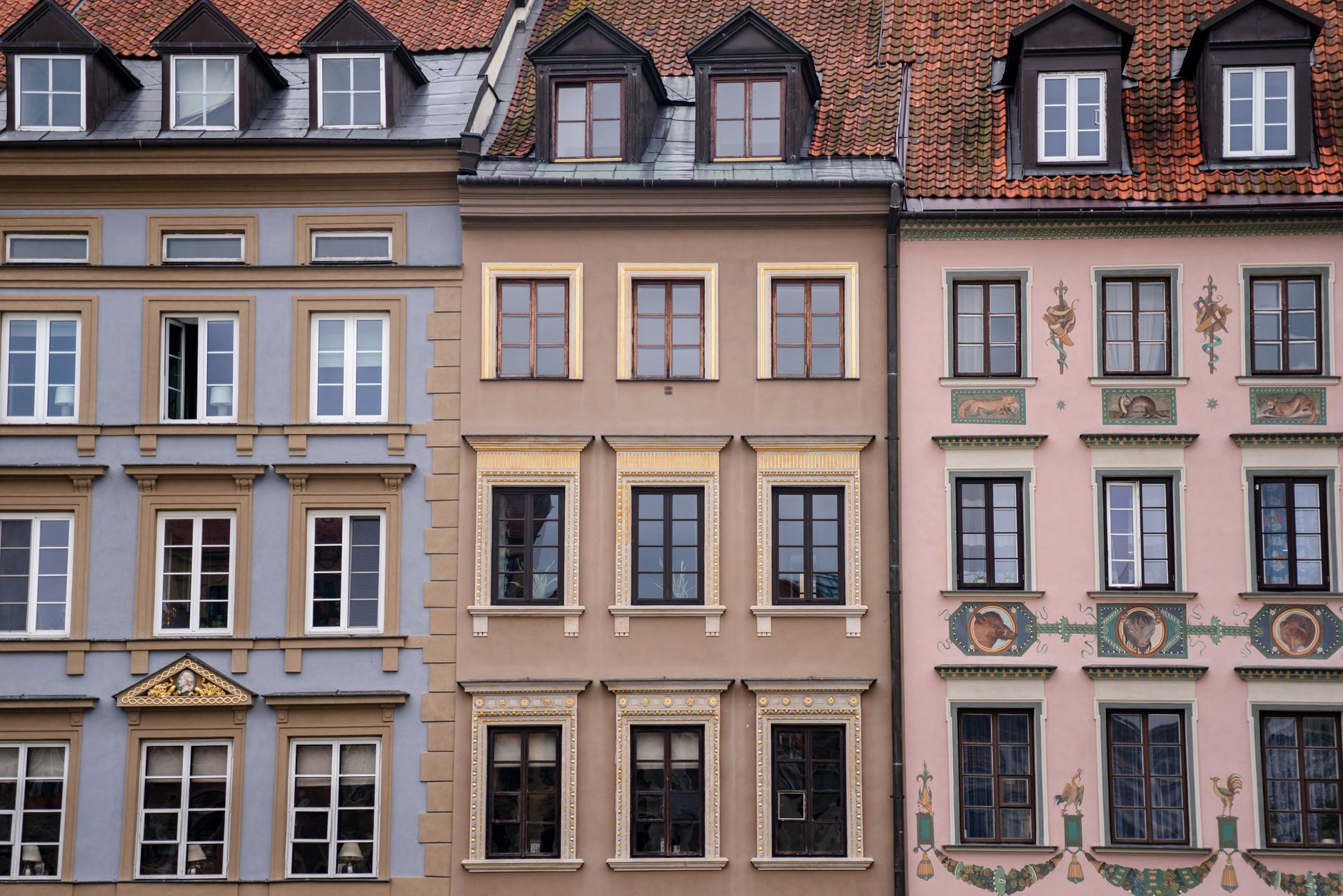 Close-up of colorful historic building facades in Warsaw, Poland.