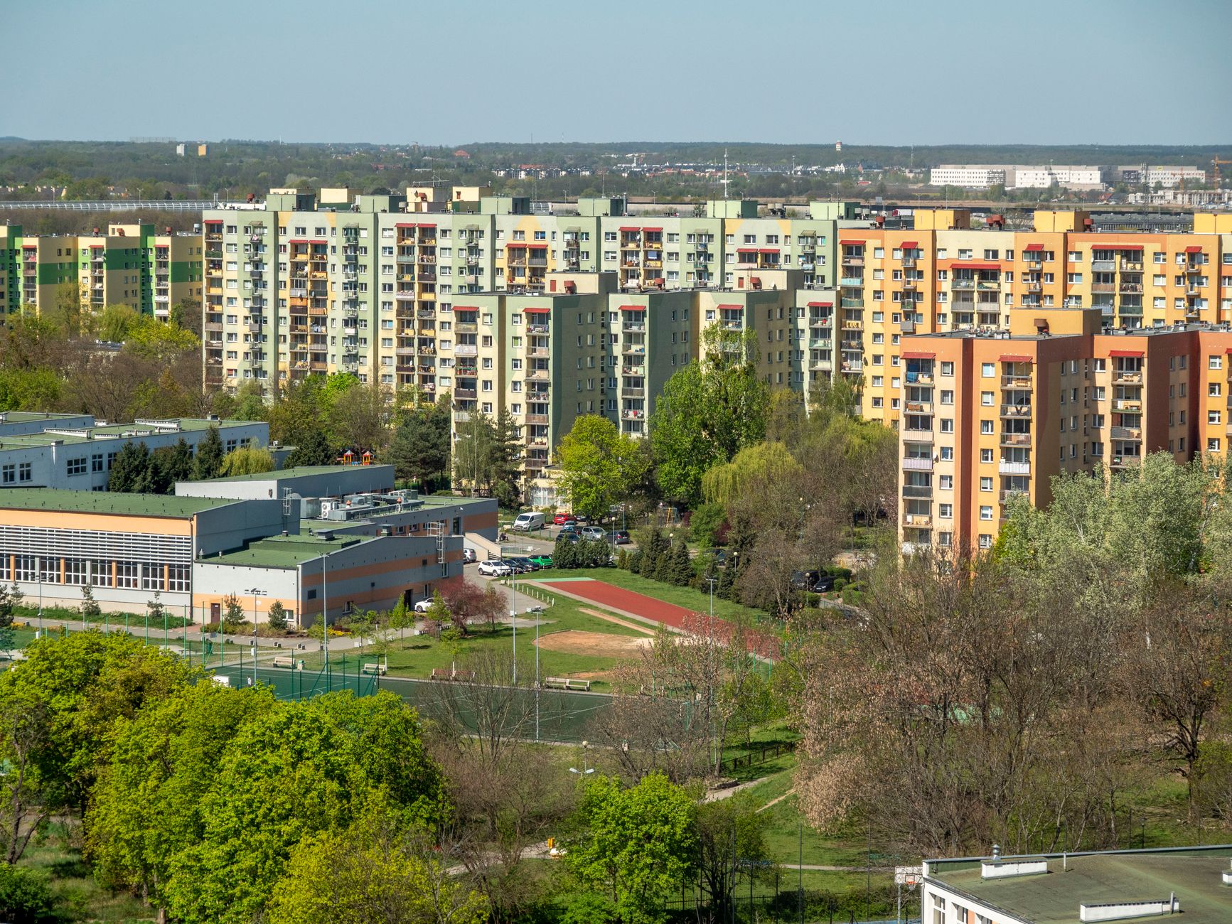 Aerial view of vibrant residential district in Wrocław, Poland highlighting colorful apartment buildings.