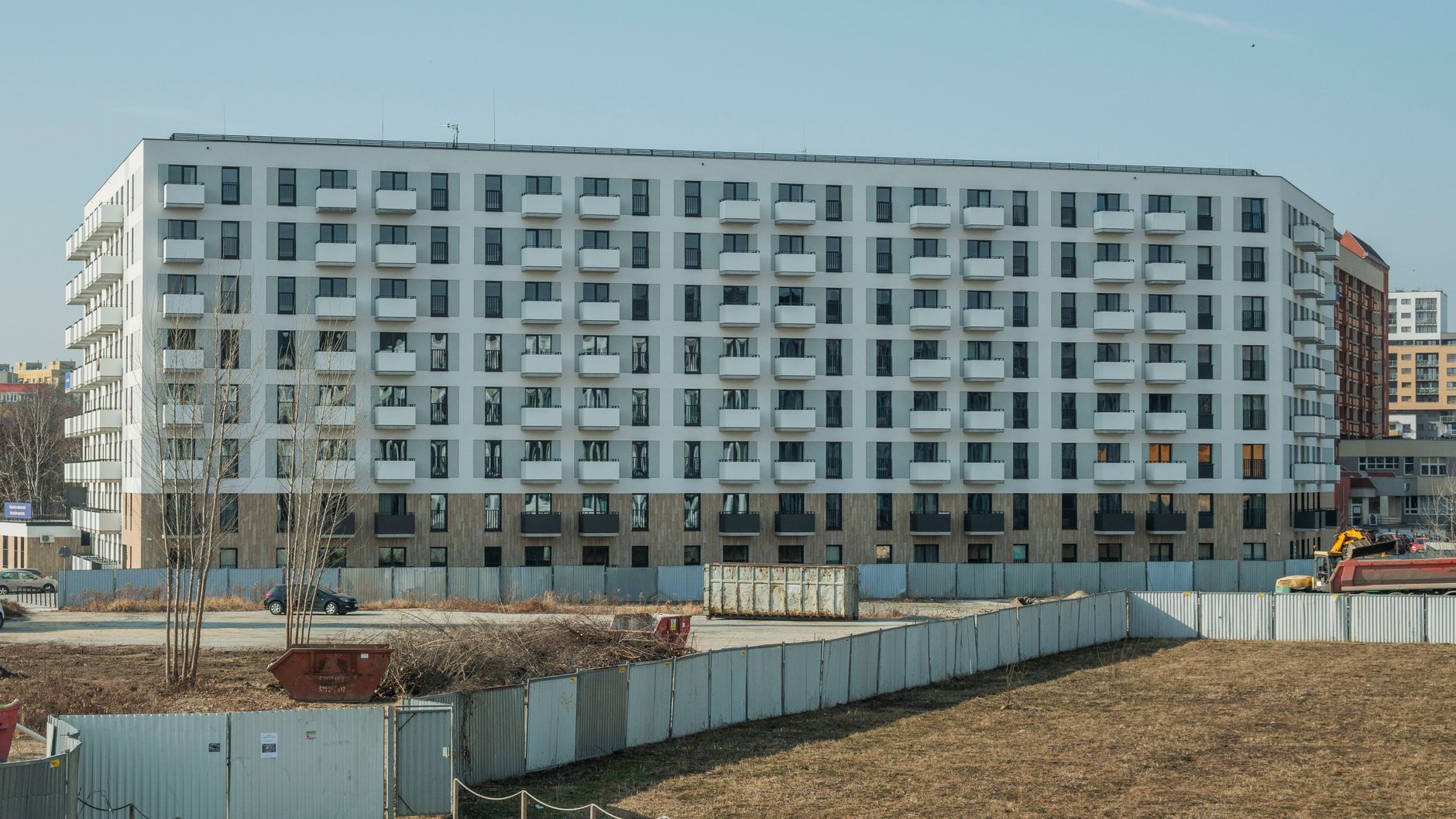 Front view of modern apartment building in Wrocław, Poland with clear sky.