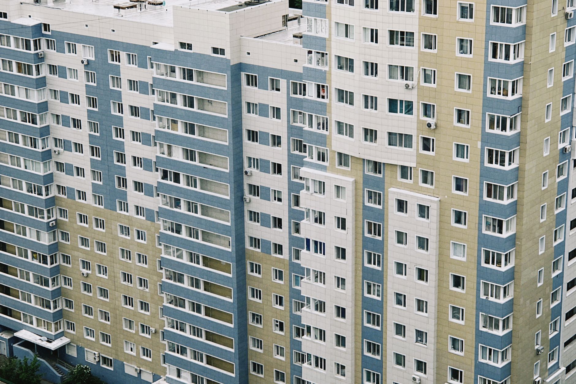 Aerial view of a contemporary high-rise apartment building in Astana, Kazakhstan.
