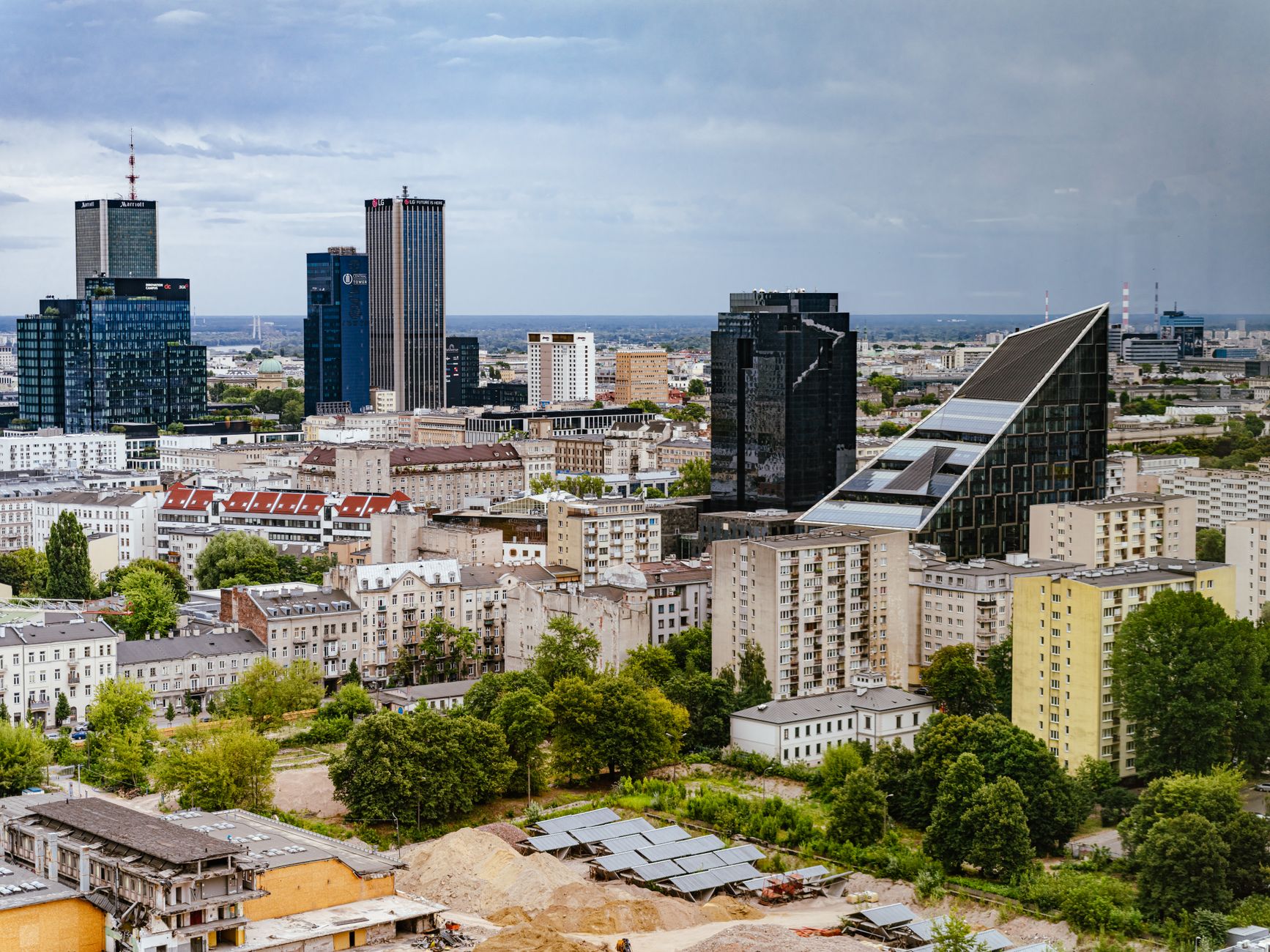 A stunning aerial view of Warsaw, highlighting modern architecture and urban skyline.