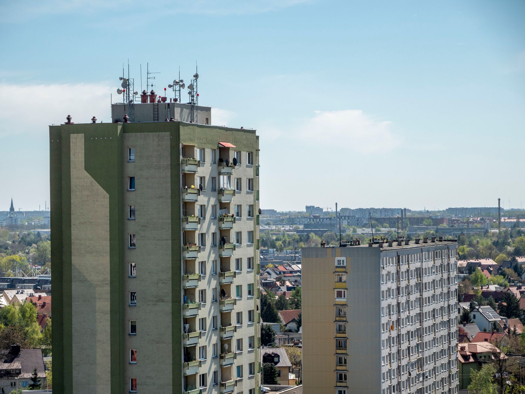 Elevated view of apartment blocks under a clear sky in Wrocław, Poland.