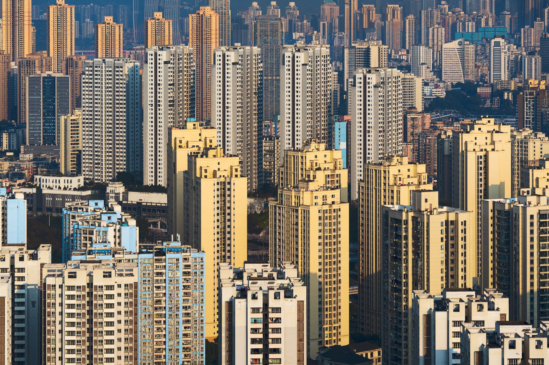 Aerial view of densely packed high-rise buildings in a vibrant urban skyline.